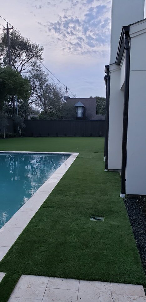 artificial turf and a swimming pool landscaping services completed for Houston, Texas residence