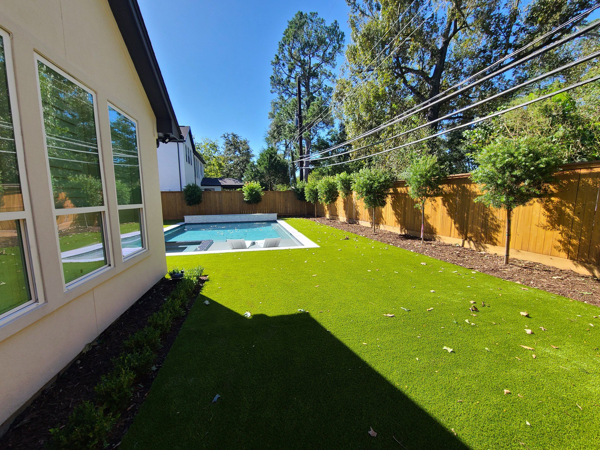 synthetic grass is a great cost-effective way for homeowners to have a beautifully landscaped yard all year round.