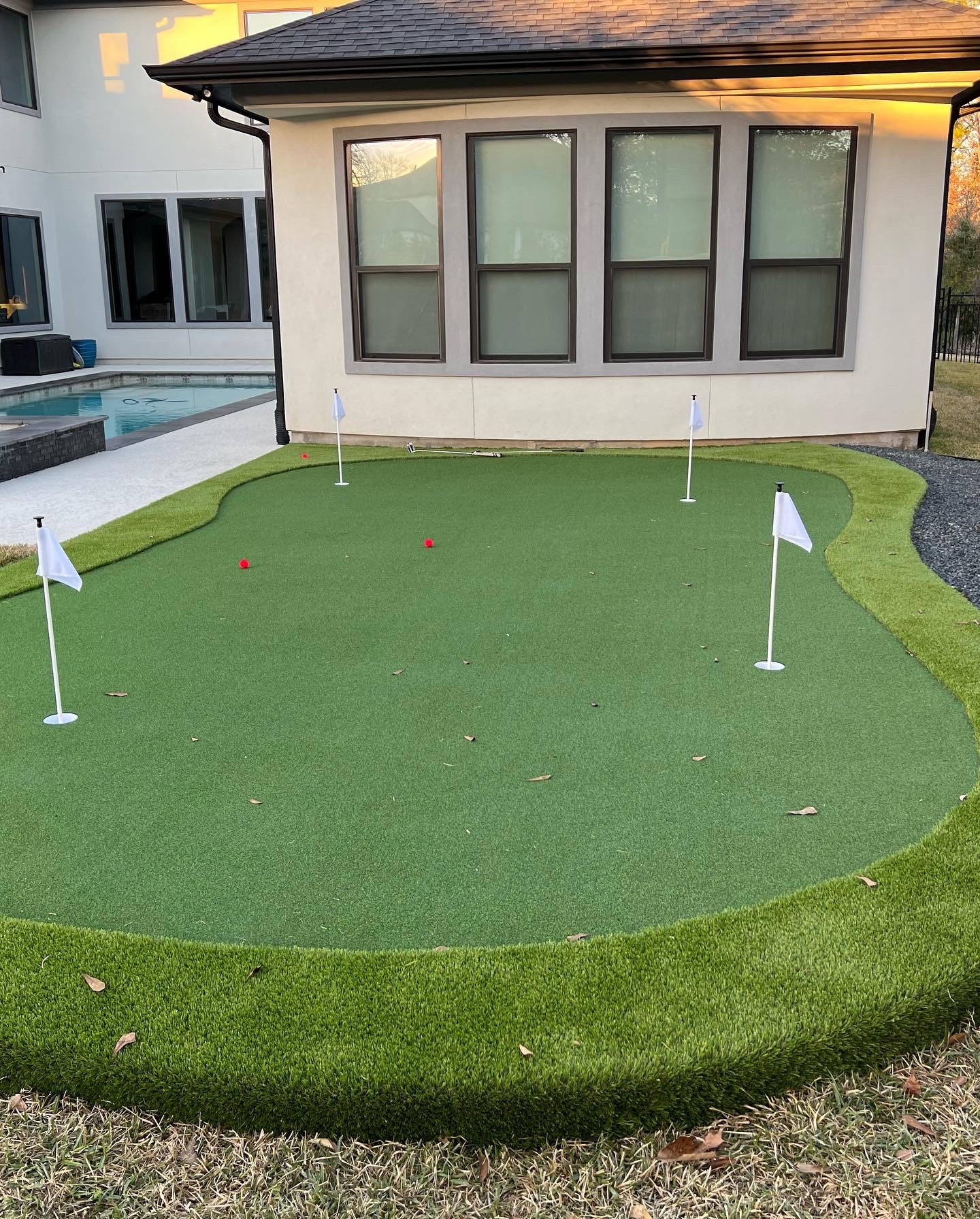 putting green installation grass landscaping work done in Houston, Texas residence