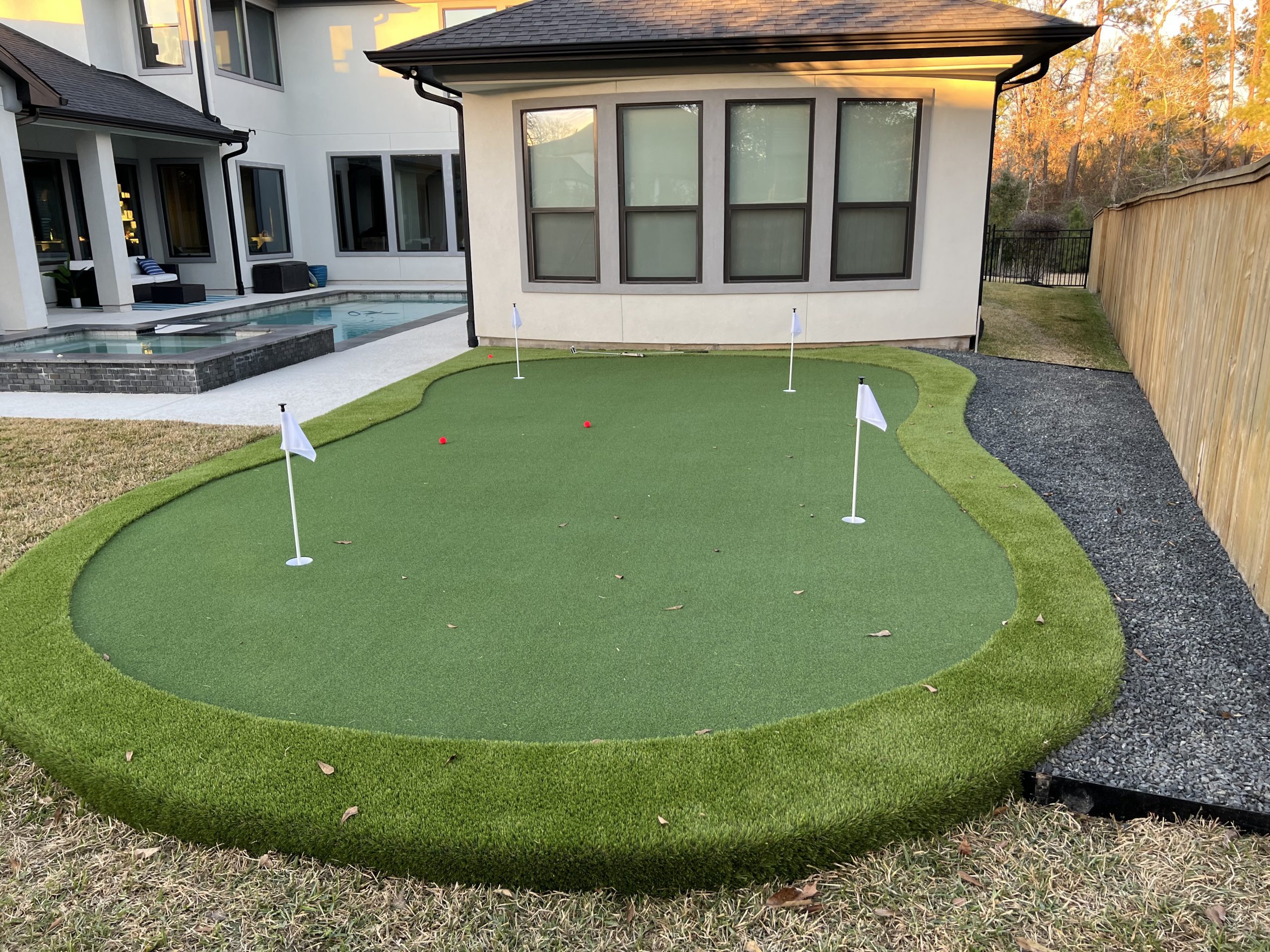 putting green installation grass landscaping work done in Houston, Texas residence