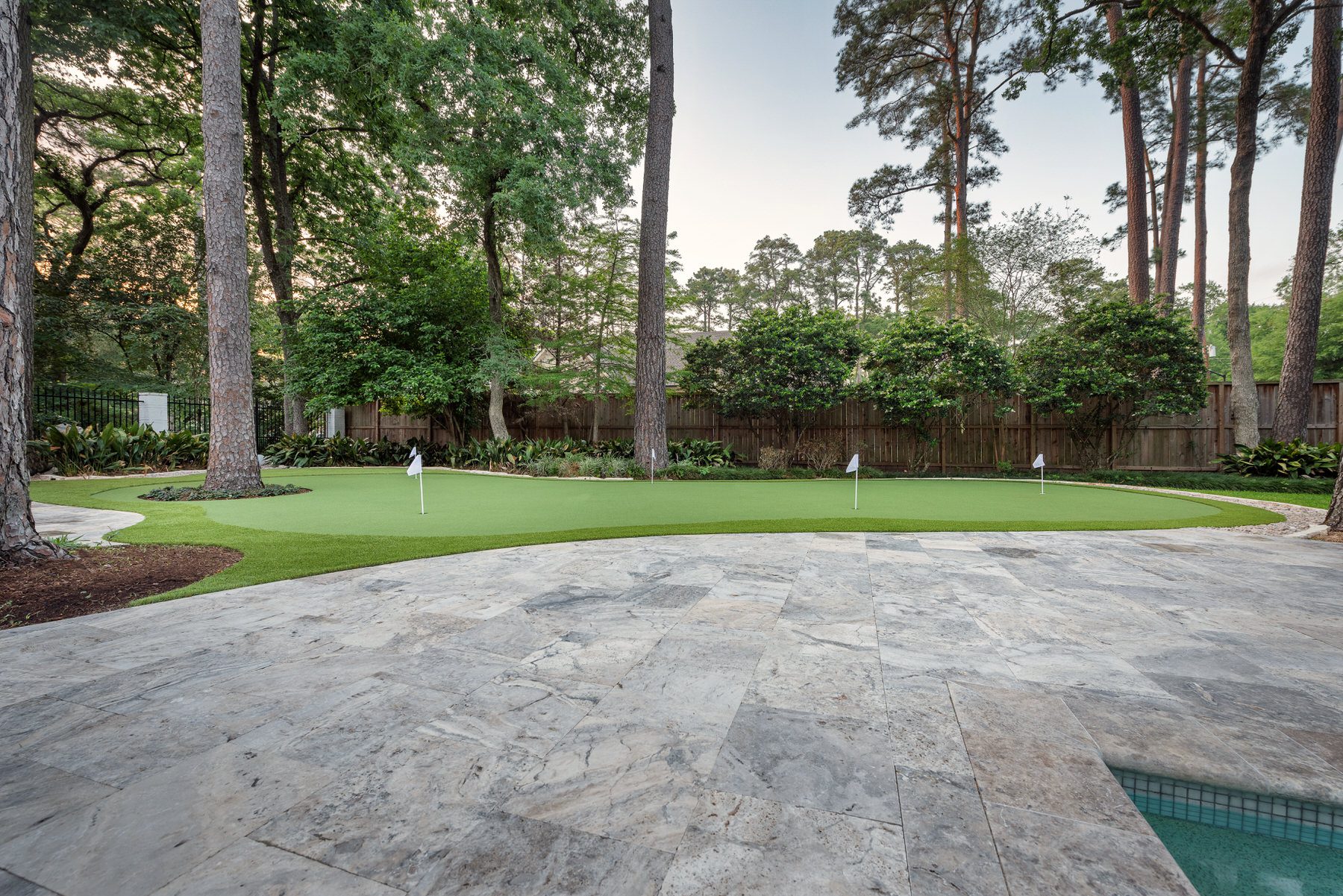 back yard artificial putting green peek